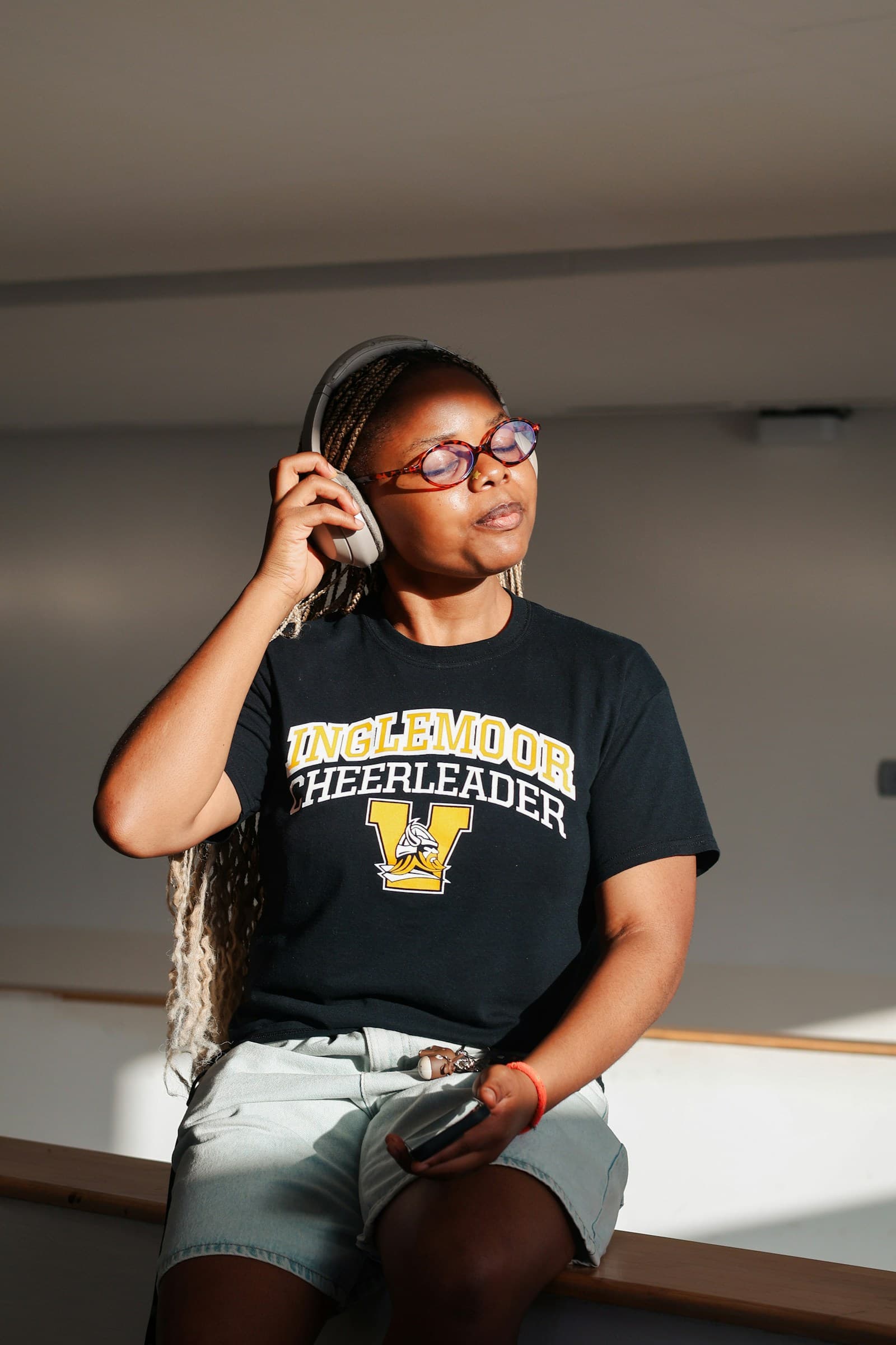 Person using headphones in a quiet indoor space